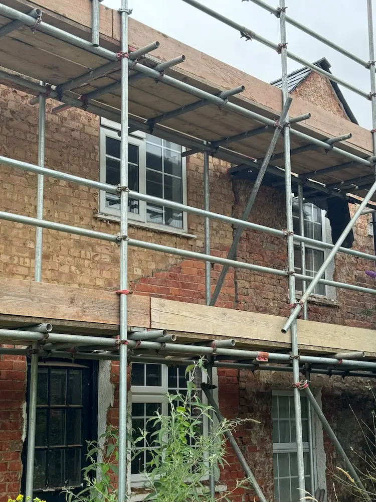 Exterior of a British house undergoing major refurbishment